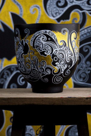 Big painted black and gold vase by artist Kenneth Kenisman