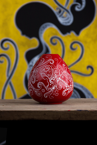 Red bowl shaped vase in a modern minimalistic style, contains a beautiful hand drawn artwork with with acrylic paint by artist kennetn kenisman. The artwork on the object depicts a nature scene, with curls, waves, sea or nature elements and intricate details. Also silhouette figures wearing an ancient helmet. The composition is well balanced.